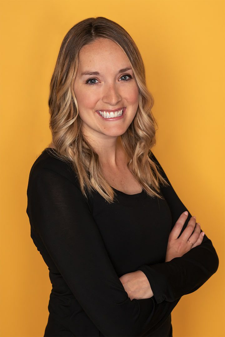 Woman with black shirt on yellow background
